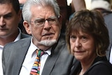 Rolf Harris arrives with daughter Bindi and niece Jenny at Southwark Crown Court.
