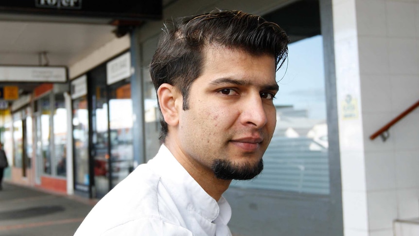 Ghana Shyam Timilsina on a busy sidewalk in Melbourne, for a story on temporary visa holders, coronavirus and JobKeeper.