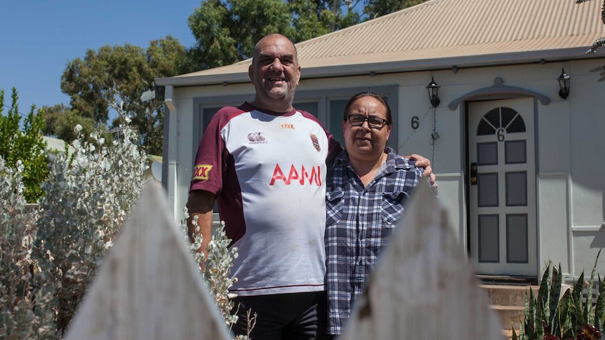 Peter Bates and Joanne Riley, aspiring foster carers, outside their Kalgoorlie home.