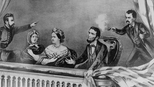 a illustration depicts the assassination of Abraham Lincoln at a theatre