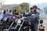Members of the Sikh community in Woolgoolga campaigning for changes in motorbike helmet laws