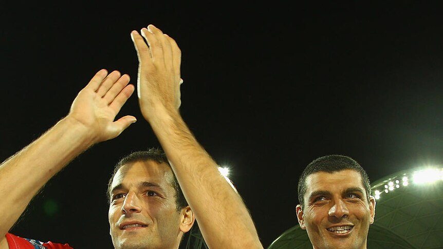 Fond farewell ... Josip Skoko and John Aloisi applaud the crowd after playing their final games before retirement.