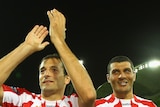 Fond farewell ... Josip Skoko and John Aloisi applaud the crowd after playing their final games before retirement.