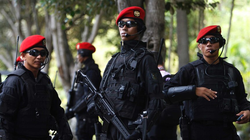 Members of the Indonesian Army's Kopassus special forces patrol.