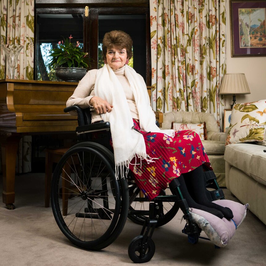 Woman in wheelchair in loungeroom