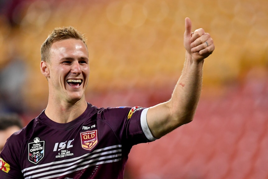 Daly Cherry-Evans holds his thumb up to the crowd