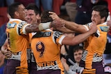 Brisbane celebrates a try in the NRL preliminary final against the Roosters