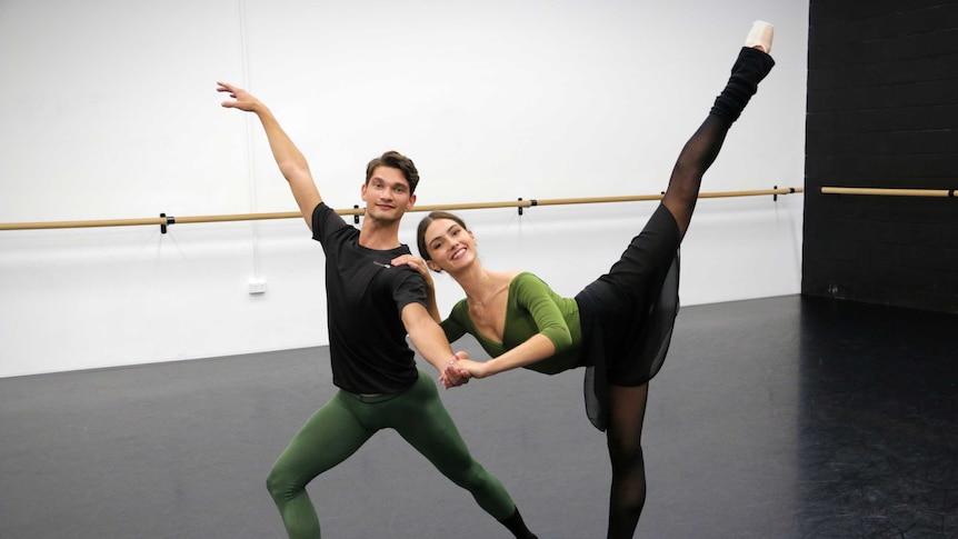 A male and female ballet dancer strike a pose.