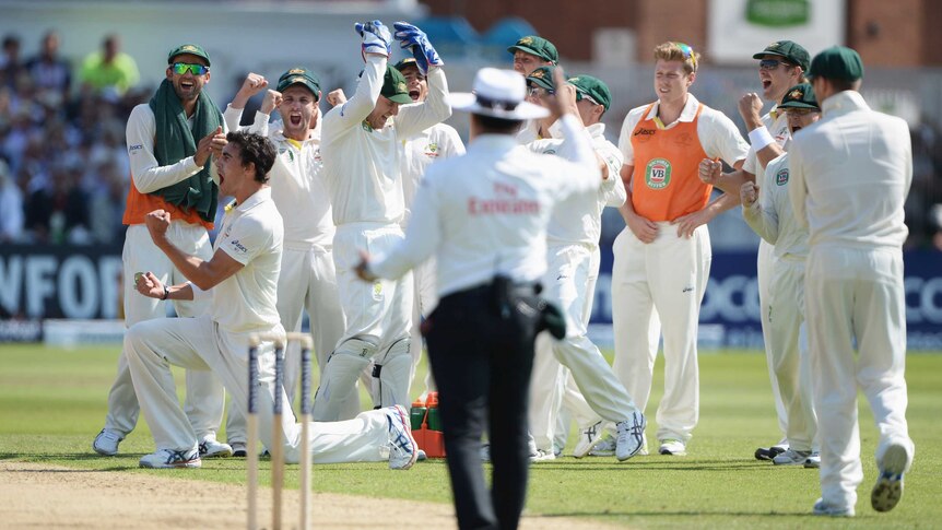 Australia's Mitchell Starc celebrates the wicket of Jonathan Trott during the first Ashes Test.