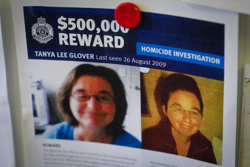 A notice says "$500,000 reward" above pictures of a woman.