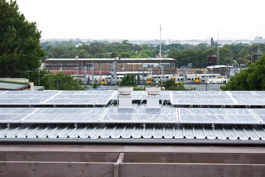 Stucco solar panels on the rooftop of the social housing building in Newtown