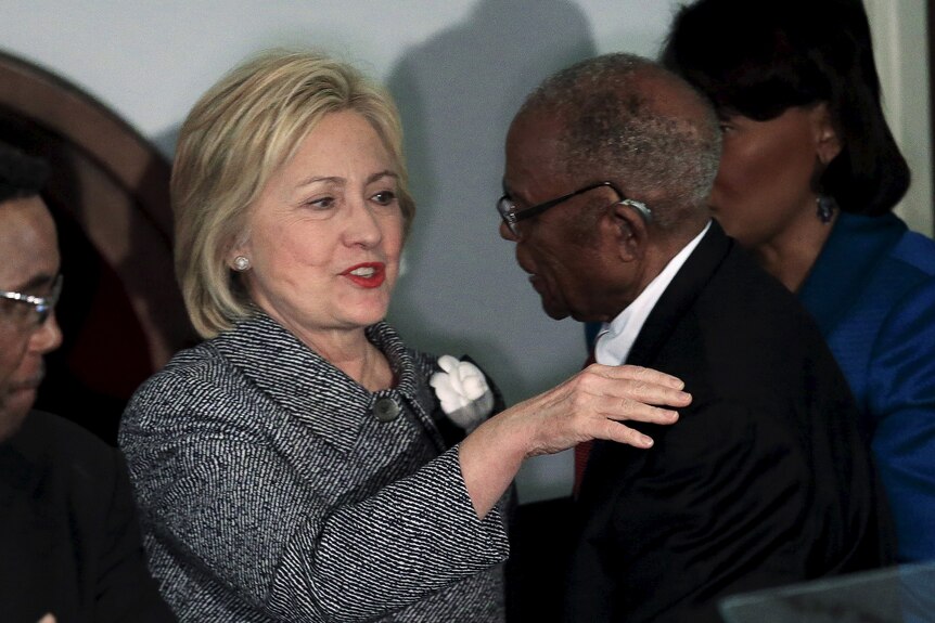 hilary clinton shakes hands and greets fred gray 
