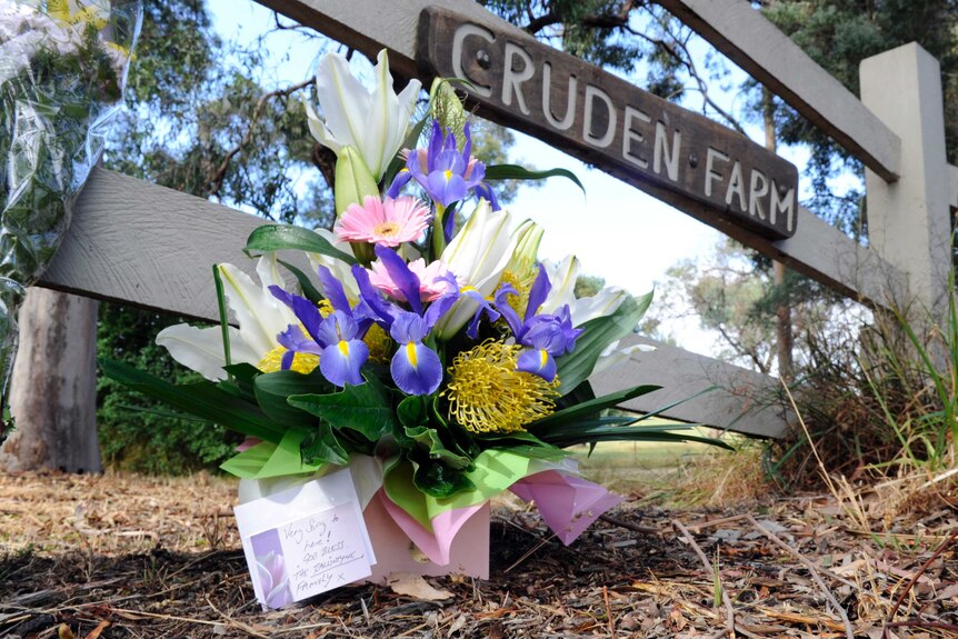 A floral tribute lies outside Cruden Farm.