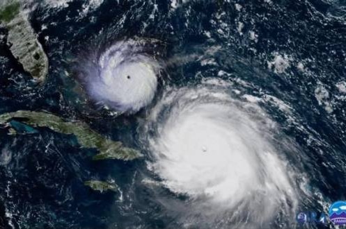 A satellite picture of Hurricane Irma with Hurricane Andrew superimposed, showing the size difference between the two storms.