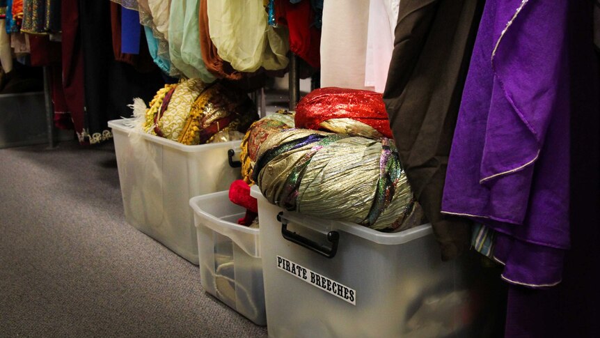 Sparkly costume hats in a box.