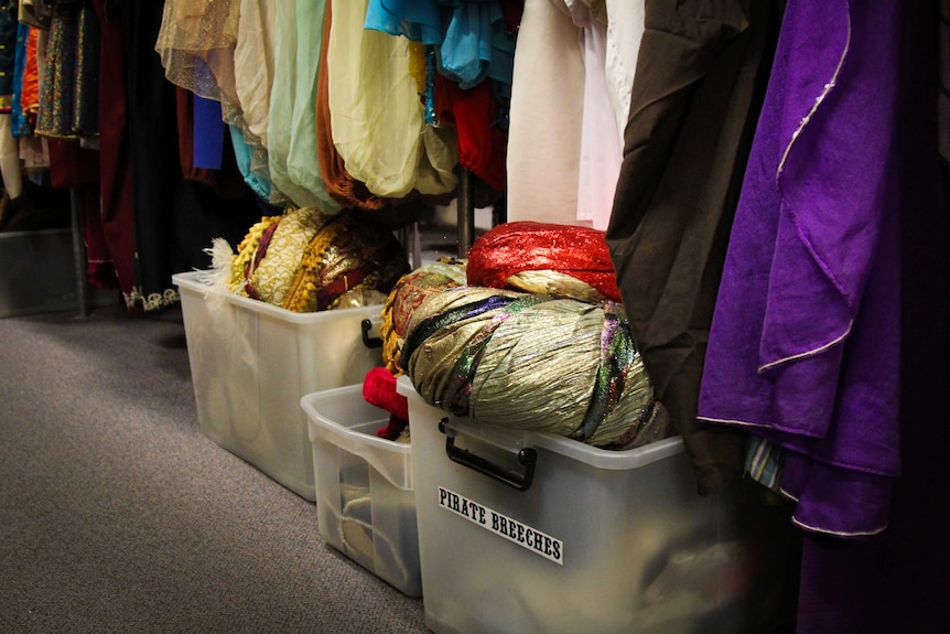 Sparkly costume hats in a box.