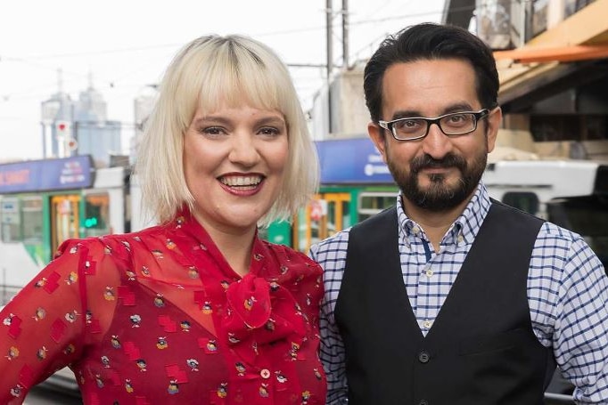 Jacinta Parsons, a woman with blonde hair, and Sami Shah, a man with a beard and glasses, smile at the camera.
