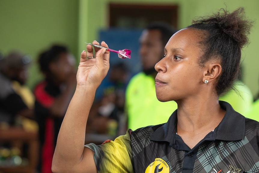 woman throwing a dart