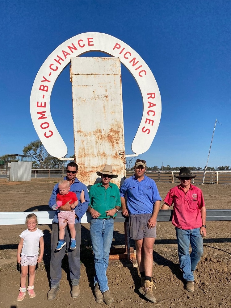 A small gathering under the finishing post at country racing club