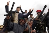 Libyan anti-regime protesters show machineguns and ammunition