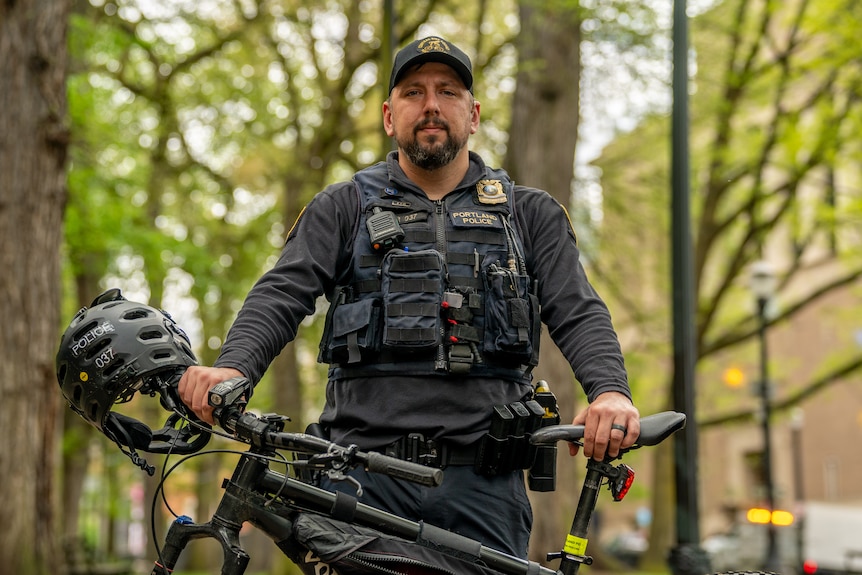 American police officer with a bicycle.