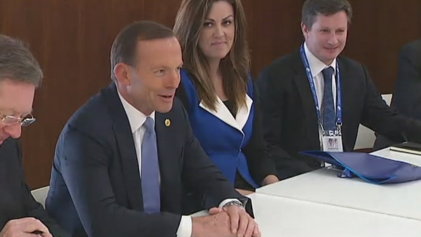 Peta Credlin sits next to Prime Minister Tony Abbott in her role as chief of staff.