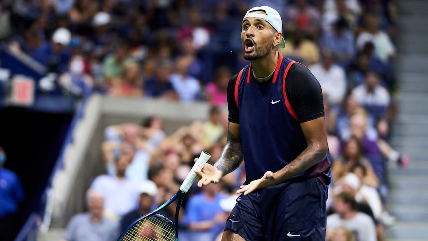 nick kyrgios yells while holding his hands in a shrugging motion