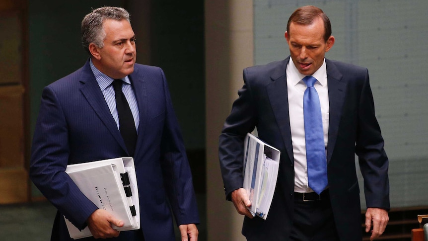Treasurer Joe Hockey and Prime Minister Tony Abbott enter Parliament in May 2014.