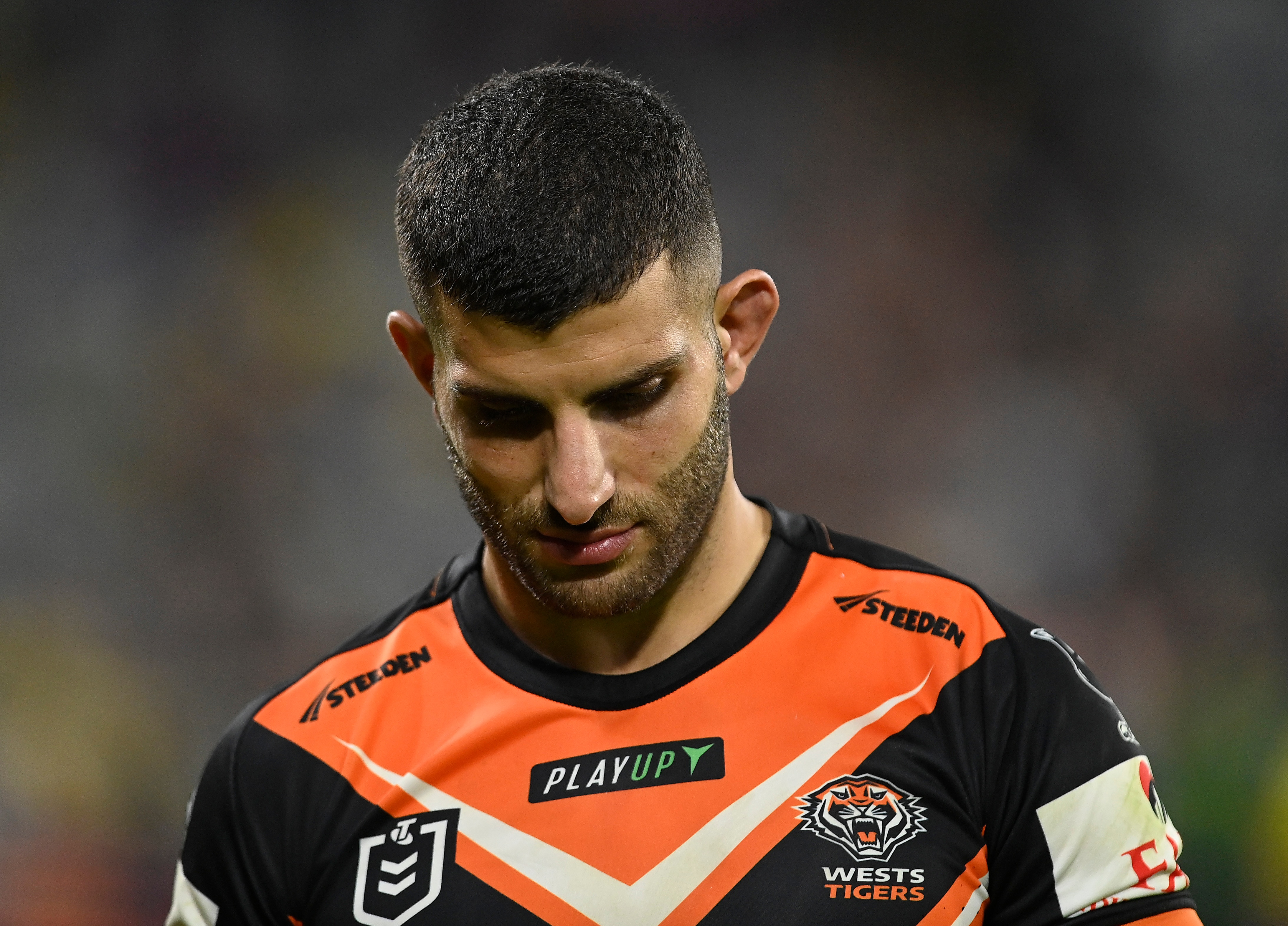 A man looks sad after losing a rugby league match