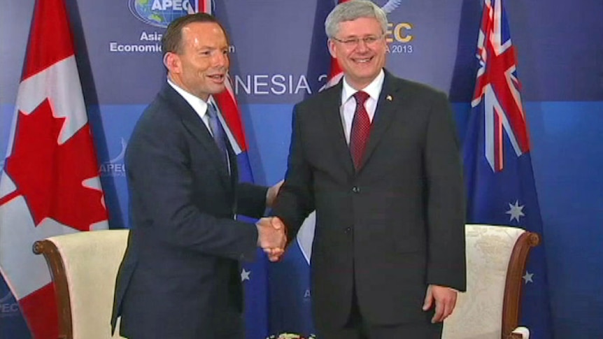 Tony Abbott and Canadian PM Stephen Harper late to opening session