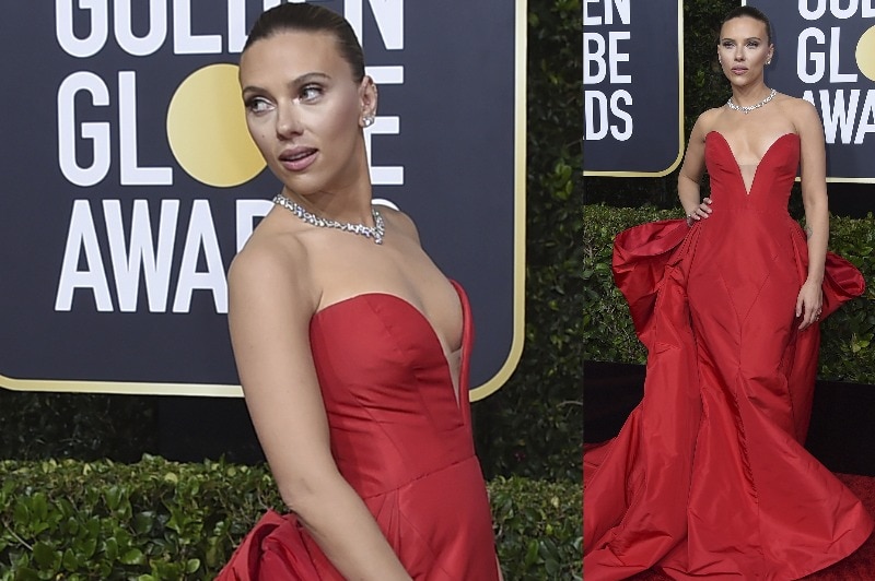 Scarlett Johansson wearing a floor-length red strapless gown with a large bow leading to the train.