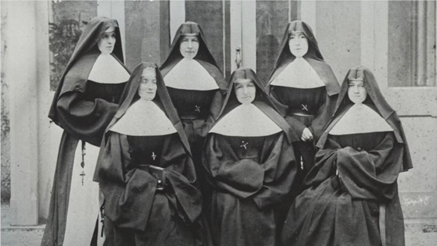 A black and white photo of six nuns in their habits