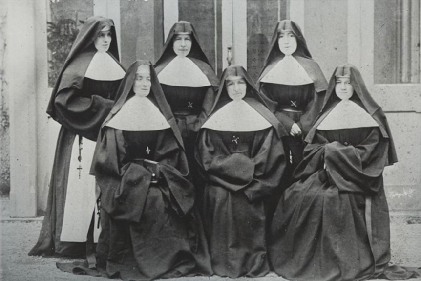 A black and white photo of six nuns in their habits
