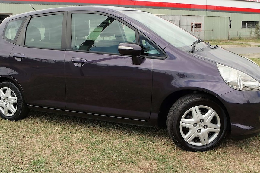 Purple car with window cracked