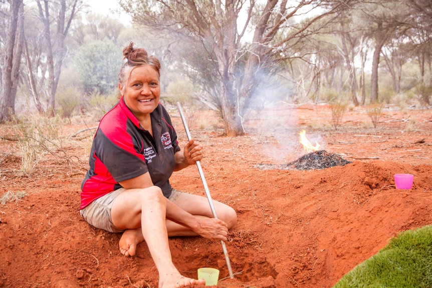 Margerie Stubb, digging honey ants with her family at a special spot in the bush near Kalgoorlie.