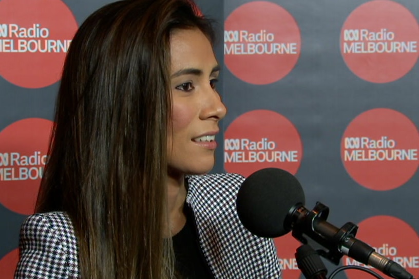 Kharla Williams speaks into a microphone while being interviewed on ABC Radio Melbourne.