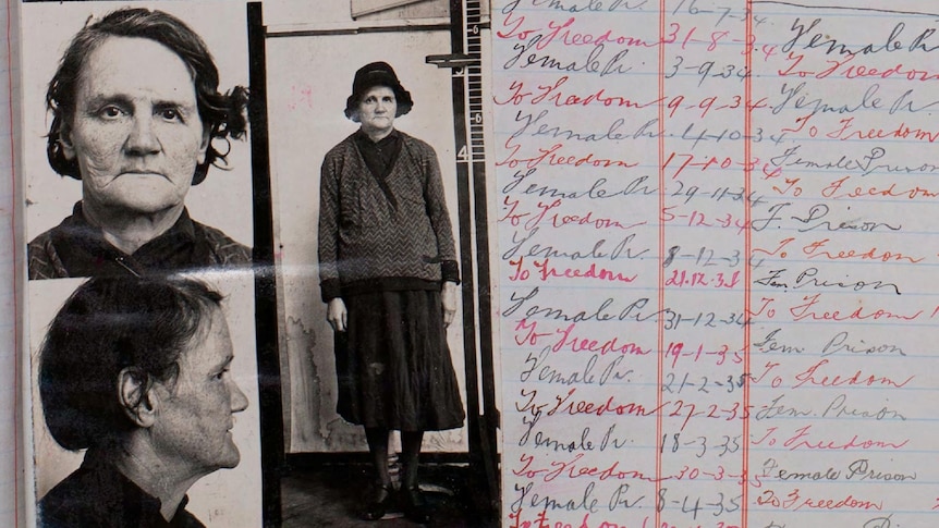 A prison register with a black and white photo of an older woman. Entries in black and red read 'to prison' and 'to freedom'.