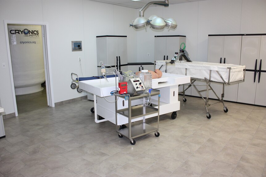 Medical equipment in a white-walled room