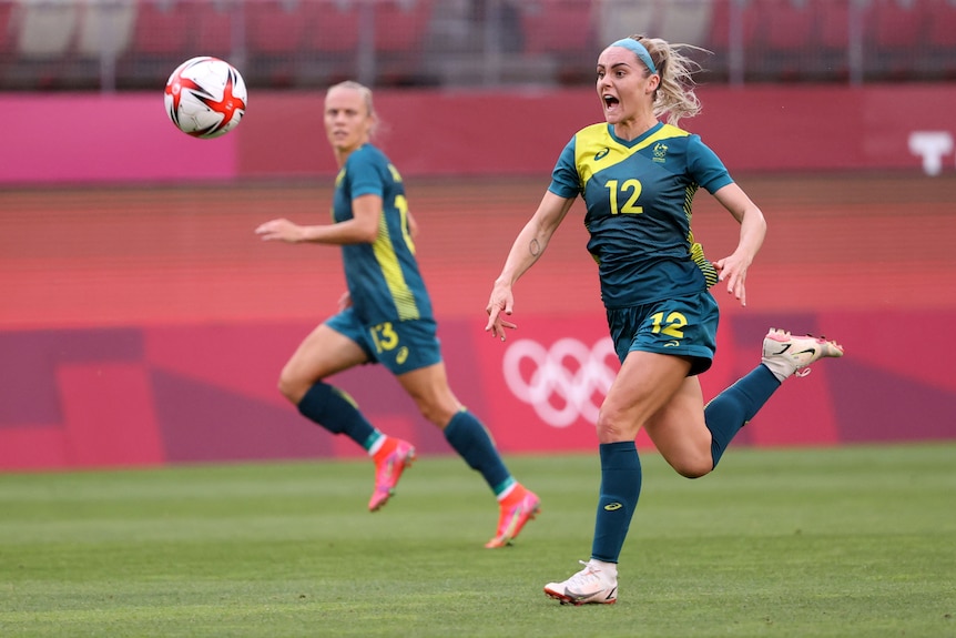 Ellie Carpenter shouts as she chases a ball.