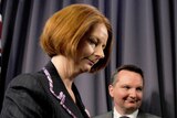 Prime Minister Julia Gillard leaves a press conference with Immigration Minister Chris Bowen