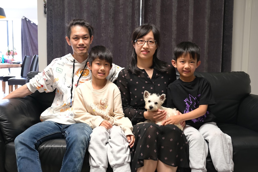 A photo of a Chinese Australian family, parents and two boys.