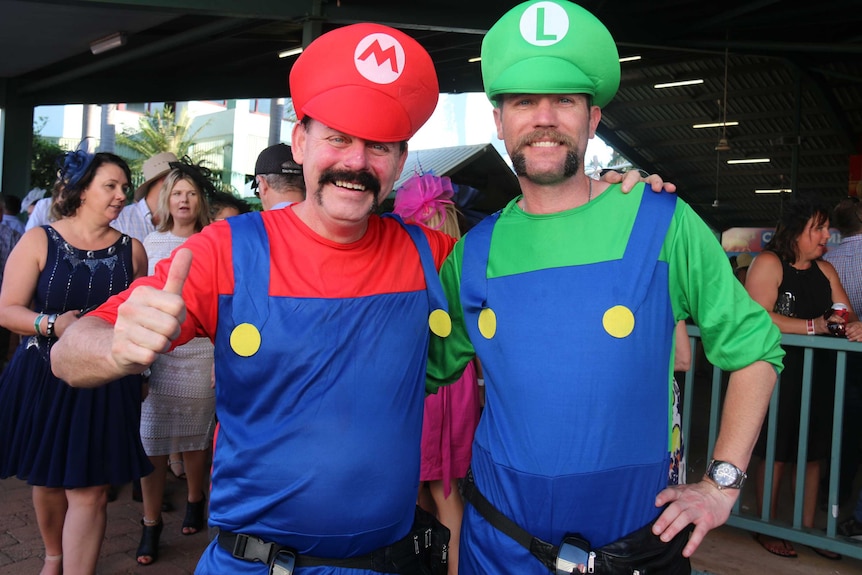 Two men dressed as the Mario brothers at the Darwin Cup.