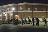 Ferguson police stand guard after shots fired