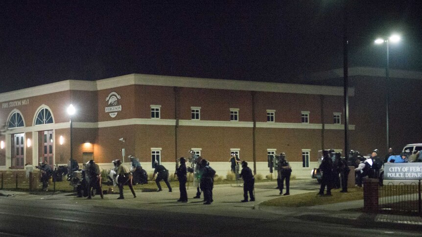 Ferguson police stand guard after shots fired