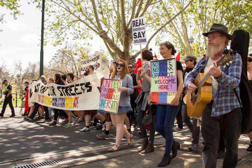 Protesters walk down a street in Bendigo during a March for Diversity.