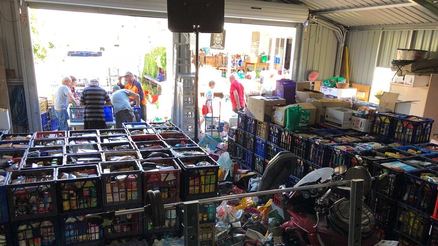 A shed filled with more than 700 milk crates of donated groceries