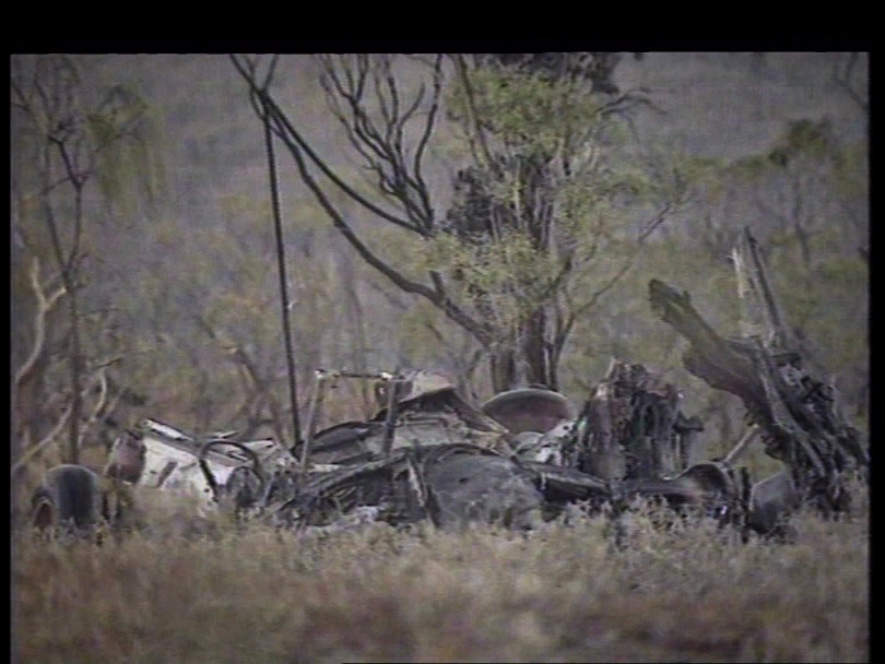 The burnt wreckage of a crashed helicopter.