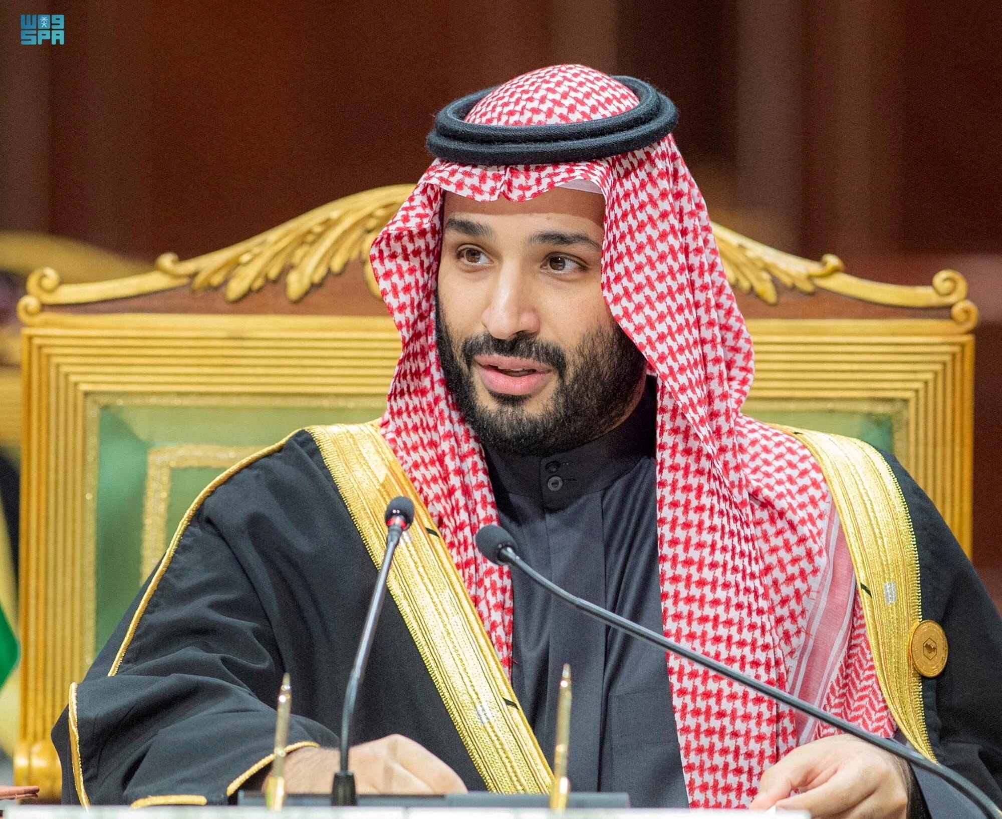 Mohammed bin Salman sitting on an ornate chair.