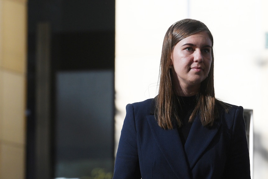 Brunette woman wearing dark suit