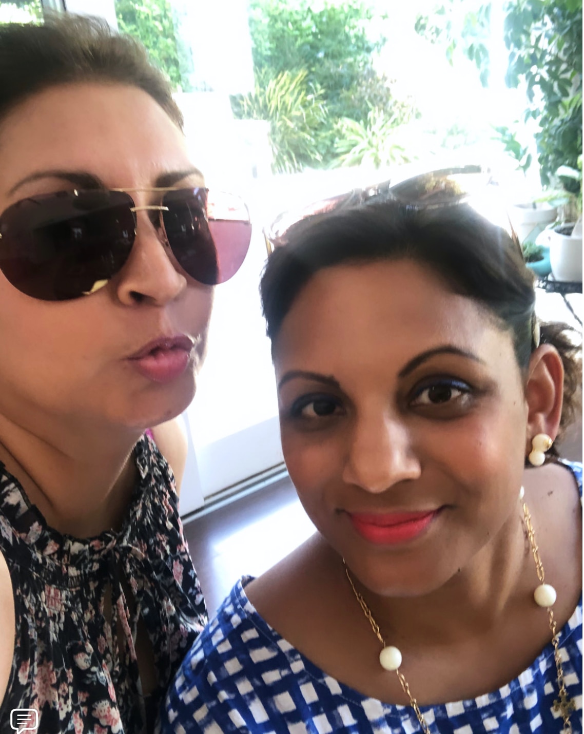 Two women pose together for a selfie.